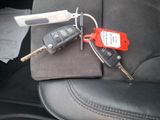 a picture of a car key with a remote control attached to it