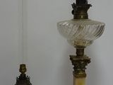 two lamps that are sitting on a table next to each other