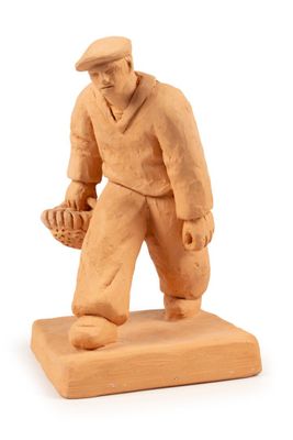 figurine of a baseball player holding a glove and a ball