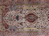 an oriental rug with a medallion design on the center of it