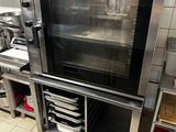 a large oven sitting in the middle of a kitchen
