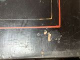 a close up of a microwave on a black table