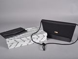 clutch bag and wallet on a white background with a black cord
