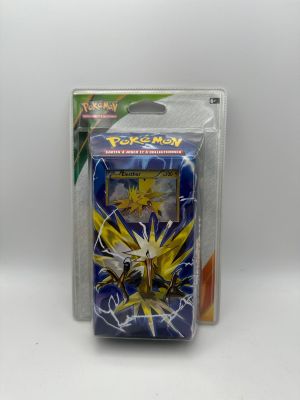 a close up of a box of pokemon cards on a white surface