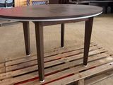 a table that is sitting on a pallet in a warehouse