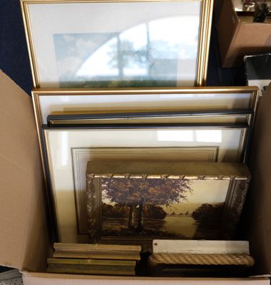 a box full of pictures and a picture frame in it