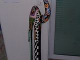 a statue of a bird that is standing next to a door