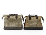 two brown and black bags sitting side by side on a white surface