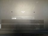 the back of a laptop with a lot of buttons on it