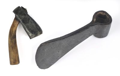 two tools that are sitting on a white surface
