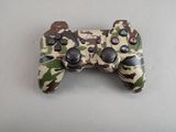 a close up of a video game controller on a table