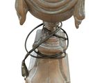 an image of a wooden table with a lamp on top of it