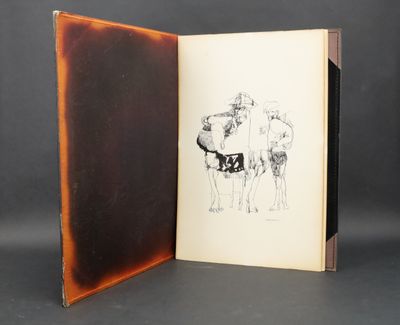 an open book with a drawing of a man and a woman on a horse