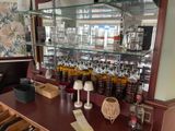 a bar with a lot of bottles of liquor on it