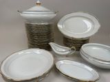 a lot of plates and bowls on the table