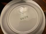 a white plate with a heart on it sitting on a table