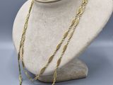 a close up of a mannequin with a necklace on it