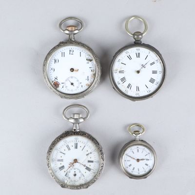 three silver pocket watches with roman numerals and roman numerals