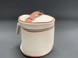 a close up of a white bag with a brown handle