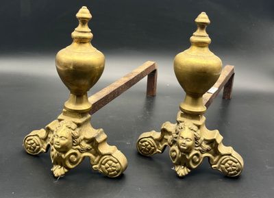 pair of antique brass candlesticks with lion heads on bases