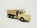 a toy truck that is sitting on a white surface