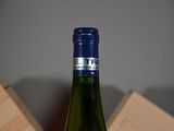 a bottle of wine that is sitting on a table