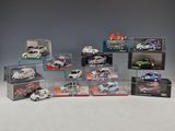a group of toy cars in display cases sitting on a table