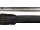 a knife that is laying on top of a knife