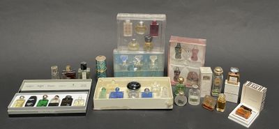 many different types of perfumes in a display case