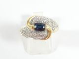 an image of a ring with a sapphire and diamonds