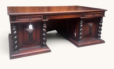 an image of a large wooden desk with two pedestals