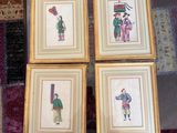 four framed pictures of people with umbrellas and umbrellas on a rug