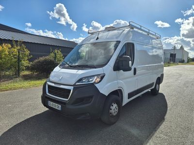 the white van is parked on the side of the road