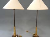 pair of brass and wood table lamps with white lampshads
