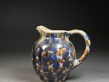 an image of a blue and white pitcher on a table