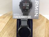 a close up of a watch on a wooden table with a box