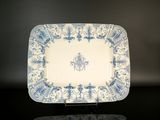a blue and white plate with a horse on it