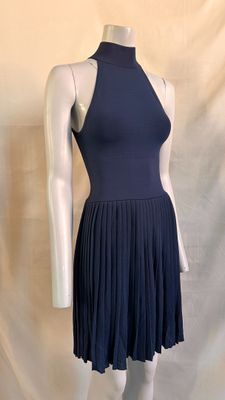 the mannequin is wearing a blue dress with a high neck