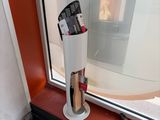 a fire place in the corner of a window next to a window sill