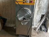 a machine that is sitting in the corner of a room
