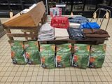 many bags of gardening supplies on a table in a store