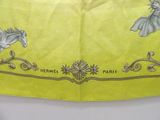 a yellow scarf with a picture of a horse on it