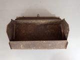 an old metal box with a handle hanging from the ceiling