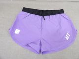 a close up of a pair of purple shorts on a couch