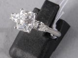an image of a diamond ring on a black ring holder