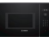 the black microwave oven is on a white background with the door open
