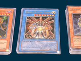 three cards are sitting on top of each other on a table