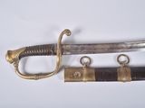 an image of a close up of a sword on a white surface