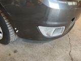 a close up of a car ' s front bumper with a hole in it
