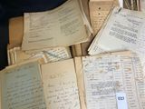 a pile of old papers sitting on top of a table